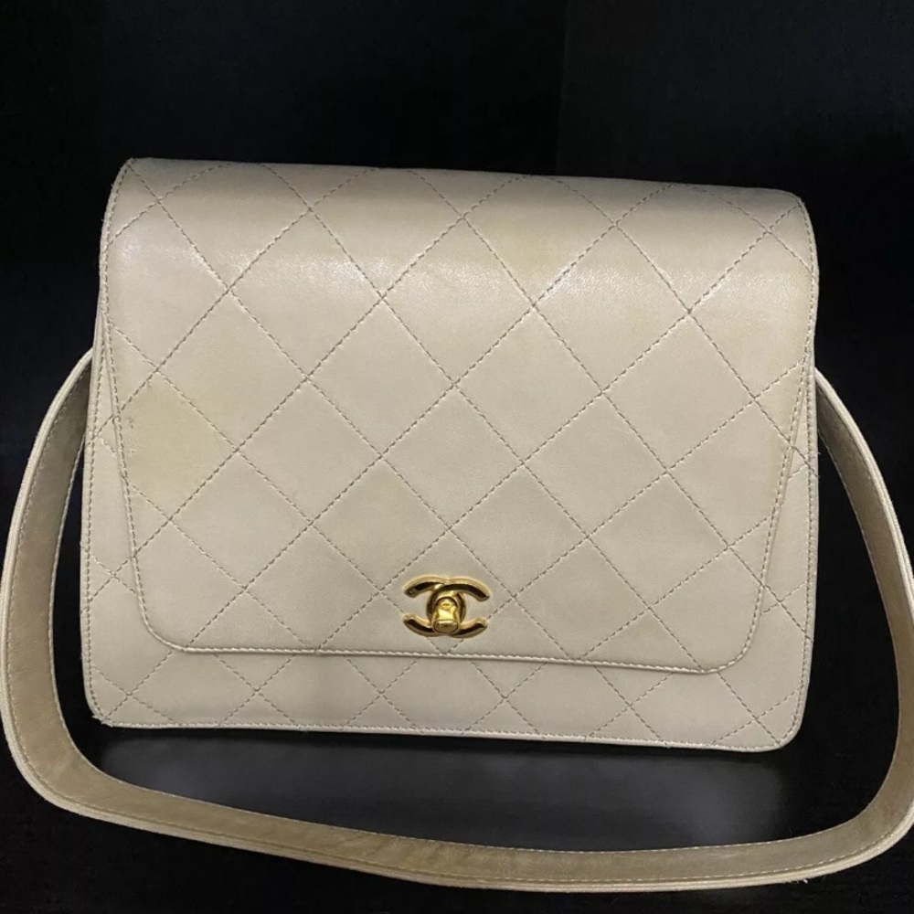 Authentic Chanel lamb skin flap quilted cc lock beige bag